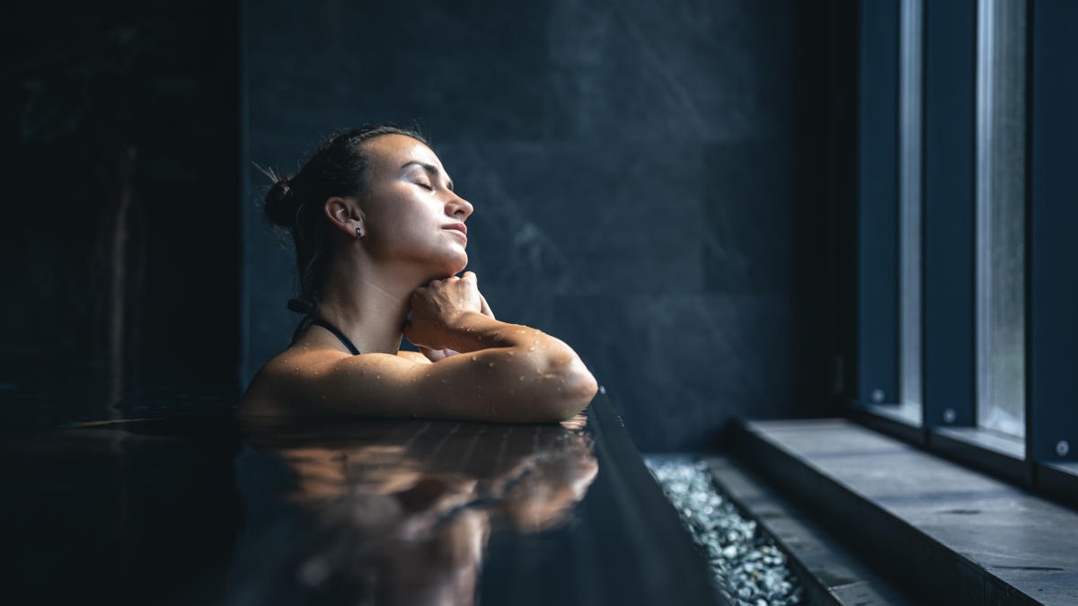 attractive-young-woman-black-swimsuit-is-relaxing-pool-1200x800 Cropped