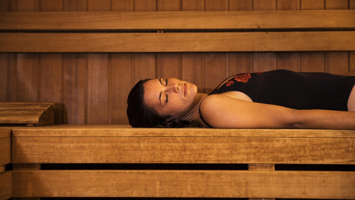 woman-relaxing-sauna-1200x800 Cropped